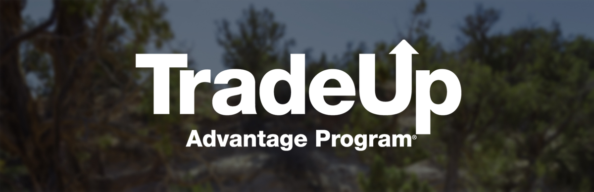 TradeUp Advantage Program text over forest. TradeUp Advantage Program text over forest.